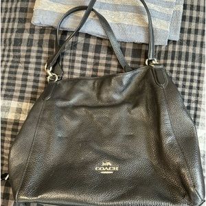 Medium size bag. Gently used. No tears or rips.